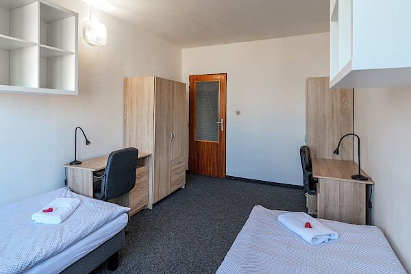 Bed in a single room